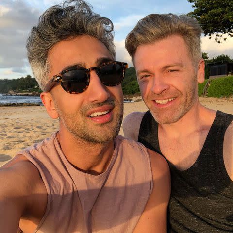 <p>Tan France Instagram</p> Tan France and Rob France pose for a photo on the beach.