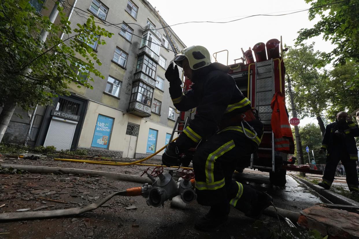 Firefighters work at the scene of an apartment building damaged by a Russian attack in Sumy (AP)