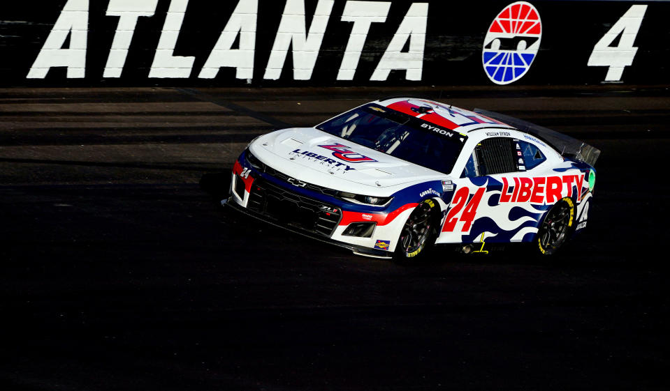 Mar 20, 2022; Hampton, Georgia, USA; NASCAR Cup Series driver William Byron (24) leads the pack out of turn four during the Folds of Honor QuikTrip 500 at Atlanta Motor Speedway. Mandatory Credit: John David Mercer-USA TODAY Sports