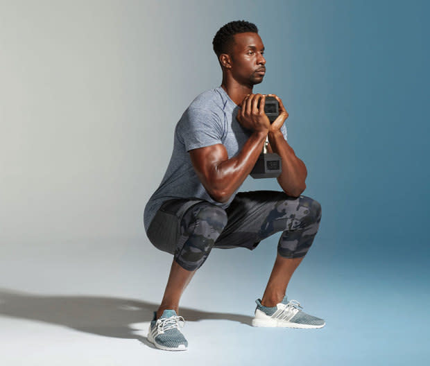 How to do it:<ol><li>Hold a dumbbell or kettlebell with two hands.</li><li>Squat by sitting the hips back and down, keeping your weight in the heels of the feet, without lifting toes.</li><li>Your elbows should touch your knees at the bottom of the squat. Rise and extend powerfully through hips to rise. That's one rep. </li></ol>