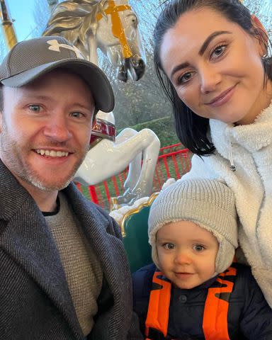 Devon Murray/Instagram Devon Murray, Shannon McCaffrey and their son pose for a selfie on a carousel.