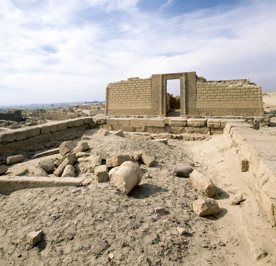 Crumbling Graeco-Roman remains at Wadi Natron, with only a single wall standing made of tan bricks