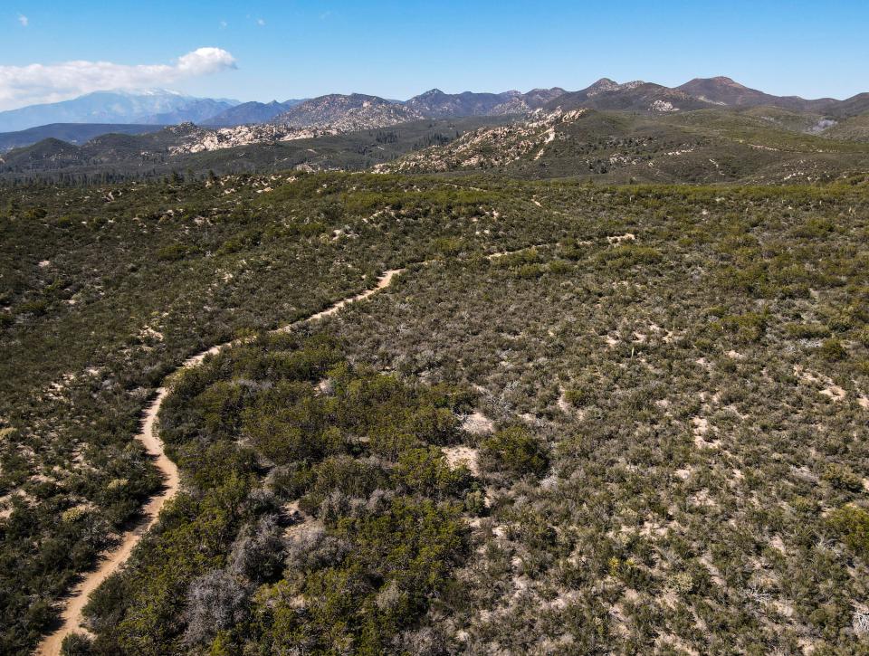 The Pacific Crest Trail is seen from above as it winds further into the mountains from in Anza, Calif., Thursday, May 11, 2023. 