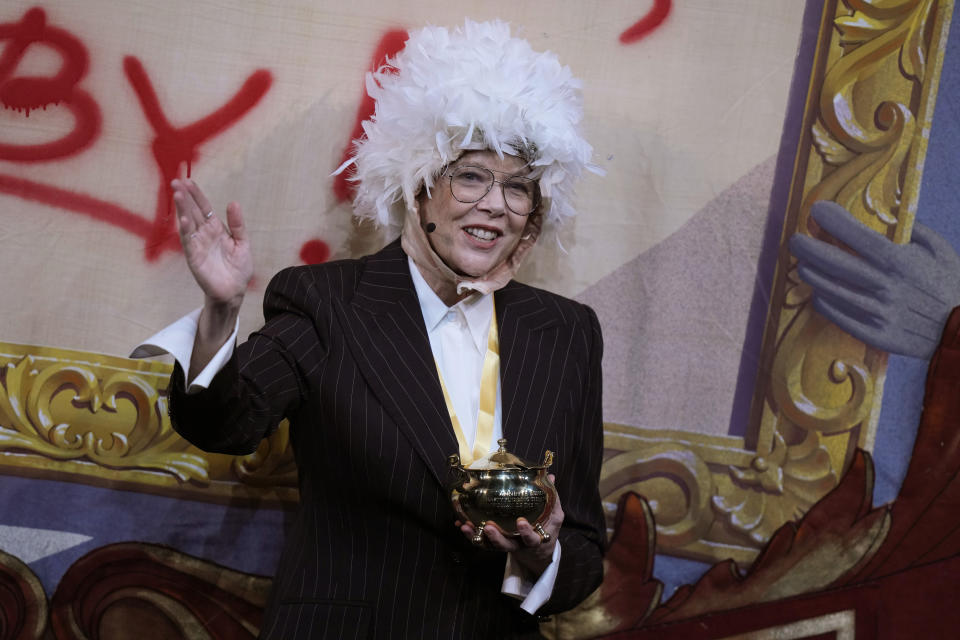 Actor Annette Bening, Hasty Pudding 2024 Woman of the Year, holds the Pudding Pot while wearing a costume of a seagull as she participates in a skit during a roast at Fargas Hall theater, Tuesday, Feb. 6, 2024, in Cambridge, Mass. The award was presented to Bening by Hasty Pudding Theatricals, a theatrical student society at Harvard University. (AP Photo/Steven Senne)