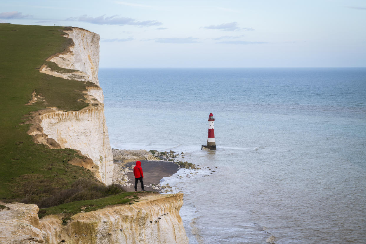 A man overlooking a view of Beachy Head from cliff edges in Eastbourne. (Getty Images)