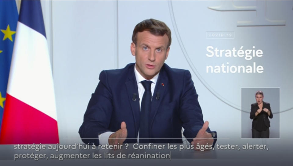 In this image made from video provided by TFI, France's President Emmanuel Macron makes a delivers a national address from Paris, Wednesday, Oct. 28, 2020. France announced a full nationwide lockdown for the second time this year and German officials imposed a partial four-week lockdown Wednesday, as governments across Europe sought to stop a fast-rising tide of coronavirus cases. (TFI via AP)