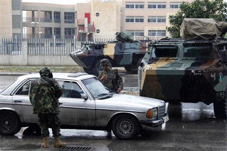 Lebanese army soldiers man a checkpoint during a patrol, following the government's decision to place the northern city under the supervision of the Lebanese army, in Tripoli, northern Lebanon, December 3, 2013. REUTERS/Mohamed Azakir