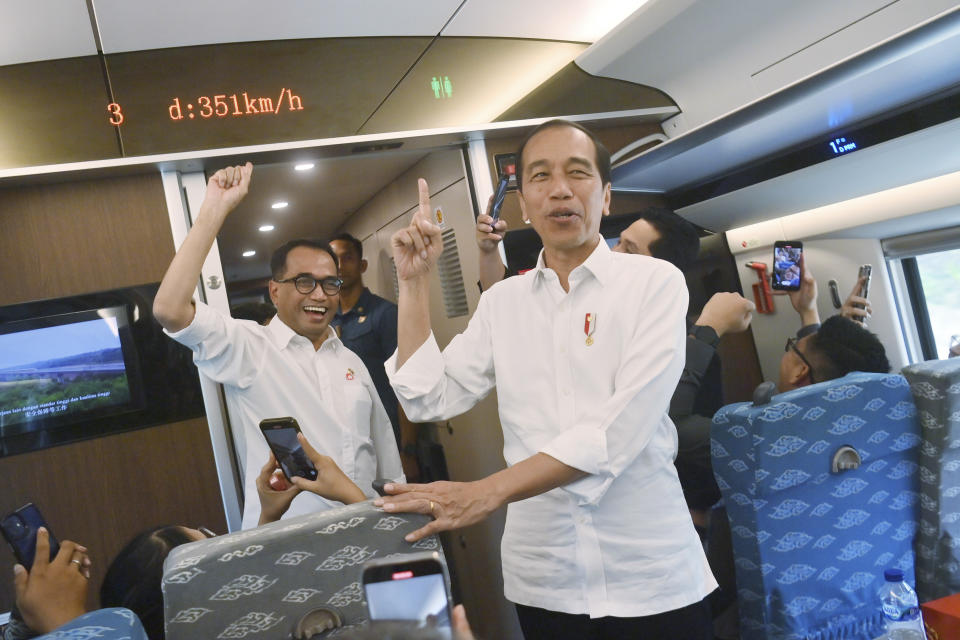 Indonesian President Joko Widodo reacts after speed of 351 km/h inside of high-speed railway during a test ride in Jakarta, Indonesia, Wednesday, Sept. 13, 2023. Indonesia's President took a test ride Wednesday on Southeast Asia's first high-speed railway as a key project under China's Belt and Road infrastructure initiative. (Akbar Nugroho Gumay/Pool Photo via AP)