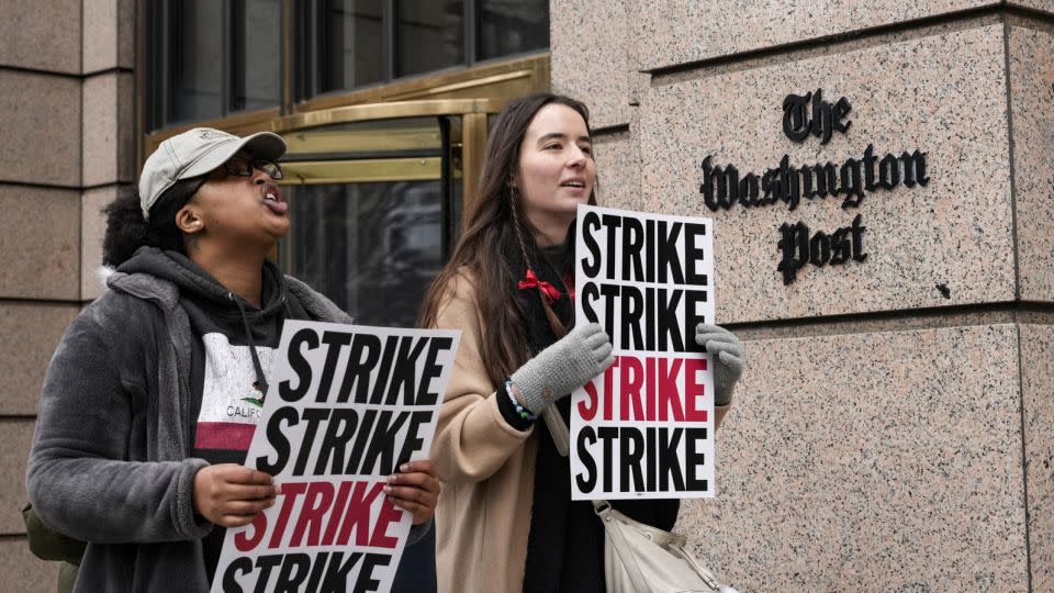 Employees of the Washington Post walk a picket line as they stage as 24-hour strike outside the Washington Post building December 7, 2023 in Washington, DC. The strike comes after 18 months of contract negotiations and warnings that more layoffs could be imminent if more staffers don't take buyouts. - Drew Angerer/Getty Images