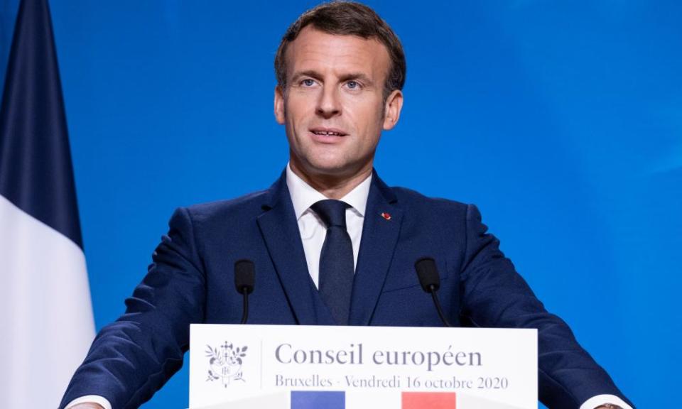 Emmanuel Macron standing at a podium