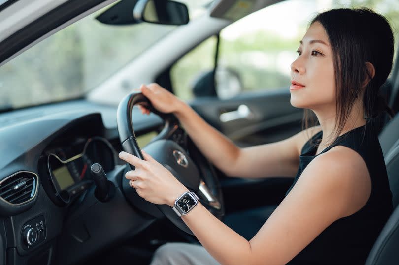 A woman driving a car