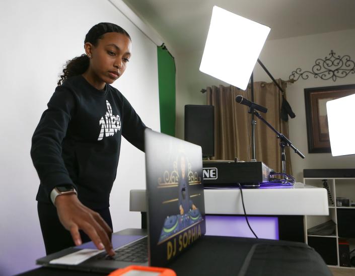 DJ Sophia Clayton rehearses at least two hours per day perfecting her craft. She&#39;s pictured in front of her equipment in her home on March 24.