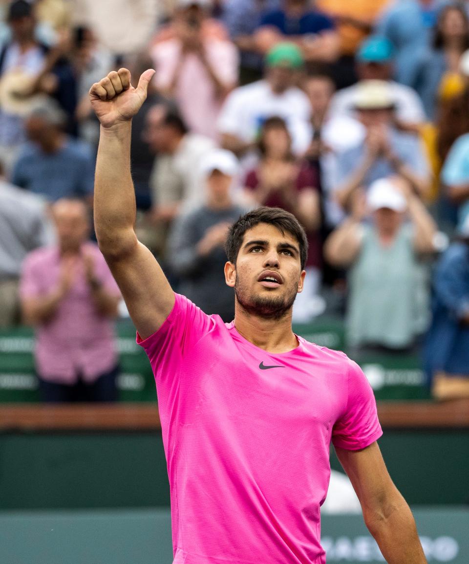 Carlos Alcaraz of Spain gestures to the crowd after winning his semifinal match against Jannik Sinner of Italy at the BNP Paribas Open at the Indian Wells Tennis Garden in Indian Wells, Calif., Saturday, March 18, 2023. 