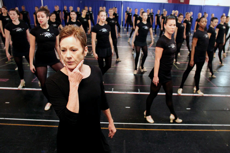 FILE - This Oct. 18, 2012 file image released by Starpix shows Rockettes director and choreographer Linda Haberman, foreground, with Rockettes dancers during rehearsals for the Radio City Christmas Spectacular at the St. Paul the Apostle Church, in New York. The Radio City Christmas Spectacular will celebrate its 85th anniversary of the Rockettes this year. The show opens Nov. 9 through Dec. 30. (AP Photo/Starpix, Dave Allocca)