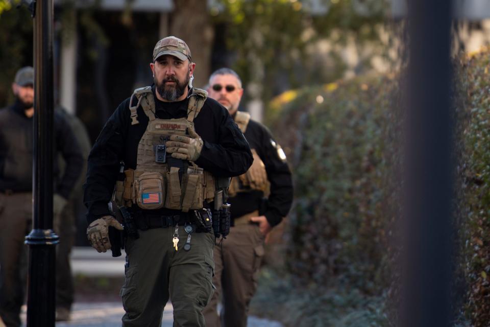 Captain Jason Chapman with the Colleton County Sheriff's Office walks toward the courtroom entrance where Alex Murdaugh will enter before day two of the jury selection at the Colleton County Courthouse on Tuesday, Jan. 24, 2022. Murdaugh is on trial for the double murder of his wife, Maggie, and son, Paul. 