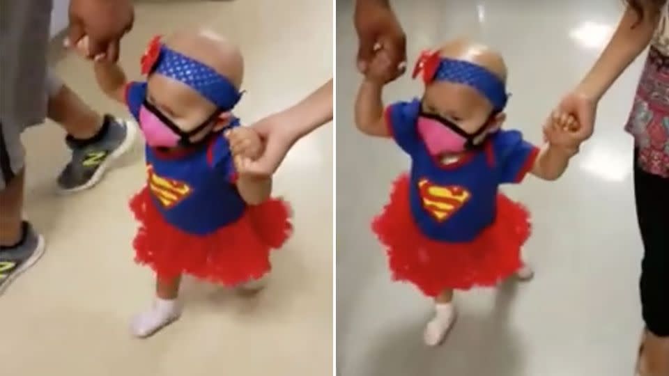 The touching moment a one-year-old girl walks out of hospital after her last chemotherapy treatment. Photo: Roxana Meza/Facebook