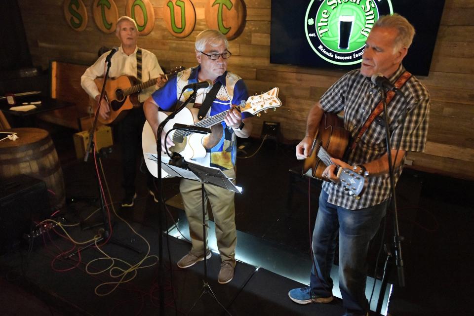 Jay Birmingham, from left, Bob Fernee and Rodney Smith perform on stage at The Stout Snug in Murray Hill Wednesday evening.