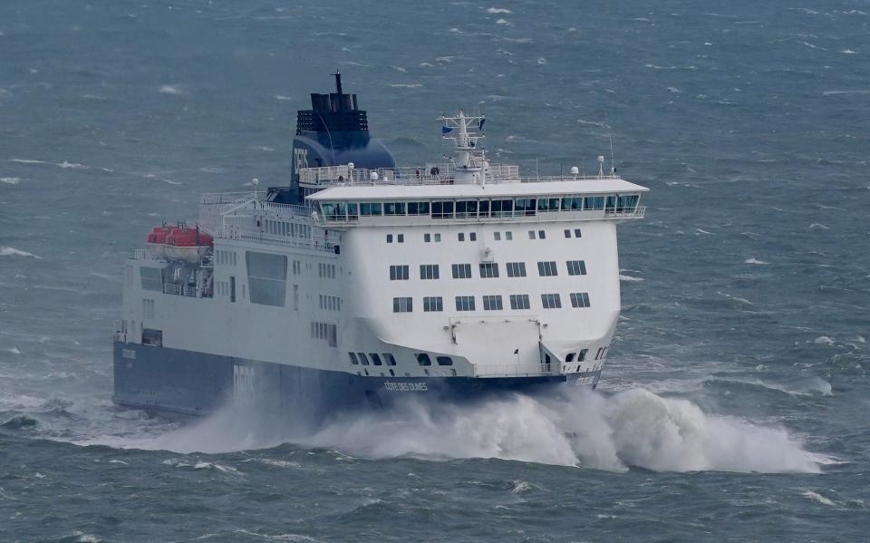 A DFDS ferry arrives at the Port of Dover in Kent during rough seas