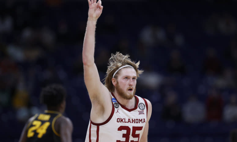 Brady Manek celebrates for Oklahoma basketball.