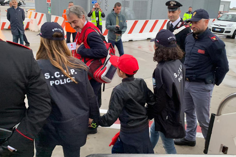 In this photo released by the Italian Police, 11-year-old Alvin, an Albanian boy who was taken to Syria by his mother when she joined the Islamic State group and then, following her death, has been freed from a crowded detention camp in northeastern Syria and returned home to Italy where his father lives, arrives at Rome's Fiumicino airport Friday, Nov. 8, 2019. (Italian Police via AP)