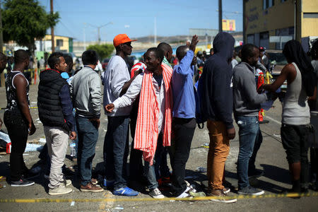 Haitian migrants line up outside Padre Chava shelter after leaving Brazil, where they sought refuge after Haiti's 2010 earthquake, but are now attempting to enter the U.S., in Tijuana, Mexico, October 3, 2016. Picture taken October 3, 2016. REUTERS/Edgard Garrido