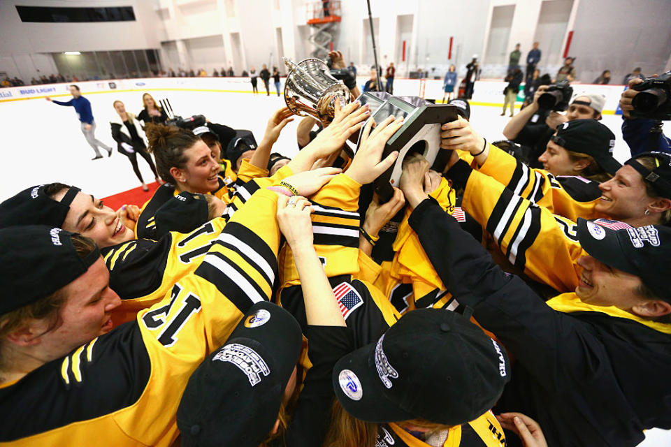 NEWARK, NJ - MARCH 12: The Boston Pride hold up the Isobel Cup after defeating the Buffalo Beauts during Game 2 of the league's inaugural championship series at the New Jersey Devils hockey House on March 12, 2016 in Newark, New Jersey. The Pride defeated the Beauts 3-1. (Photo by Andy Marlin/Getty Images for NWHL)