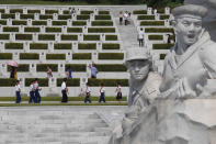 Pyongyang citizens visit the Fatherland Liberation War Martyrs Cemetery in Pyongyang, North Korea, Tuesday, July 27, 2021 to mark the Korean War armistice anniversary. The leaders of North and South Korea restored suspended communication channels between them and agreed to improve ties, both governments said Tuesday, amid a 2 ½ year-stalemate in U.S.-led diplomacy aimed at stripping North Korea of its nuclear weapons. (AP Photo/Jon Chol Jin)