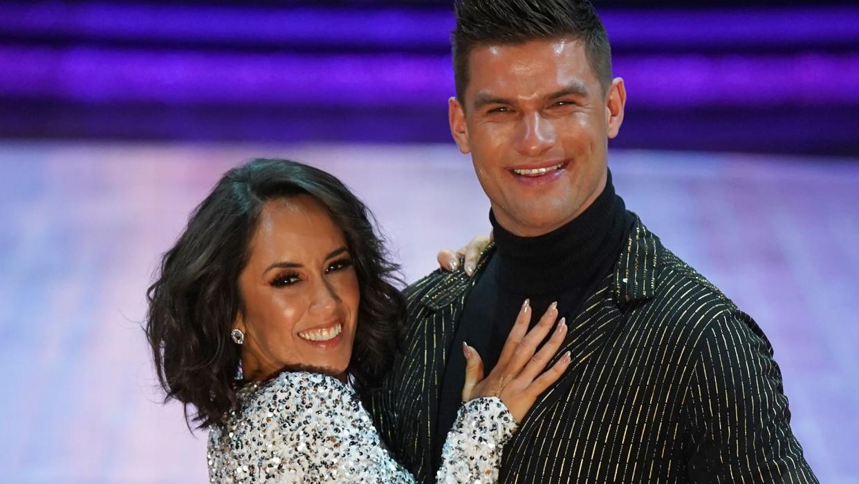 Janette Manrara in a silver sequin jumpsuit with Aljaz Skorjanec 