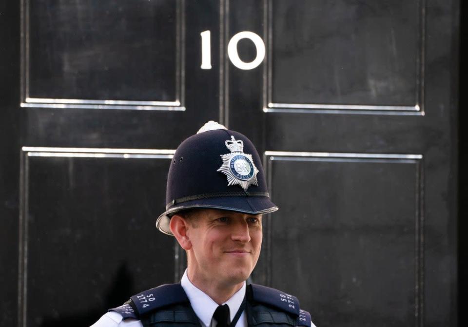 A Metropolitan Police officer stands outside 10 Downing Street (Dominic Lipinski/PA) (PA Wire)