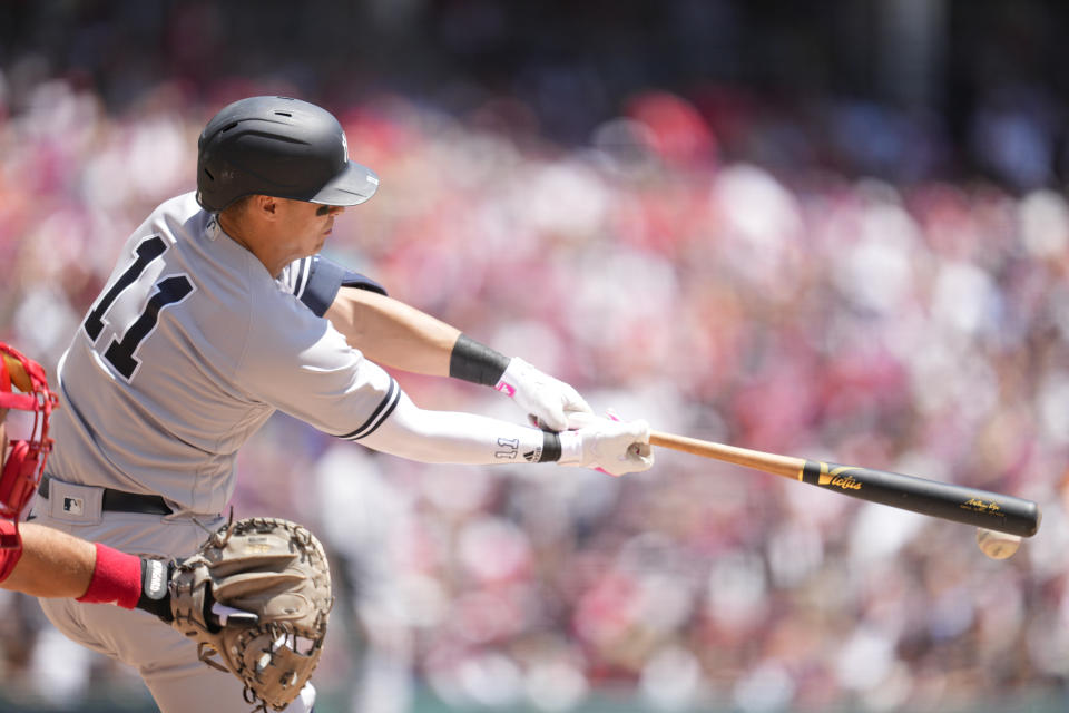 New York Yankees' Anthony Volpe (11) hits a one-run double against the Cincinnati Reds in the seventh inning of a baseball game in Cincinnati, Sunday, May 21, 2023. (AP Photo/Jeff Dean)