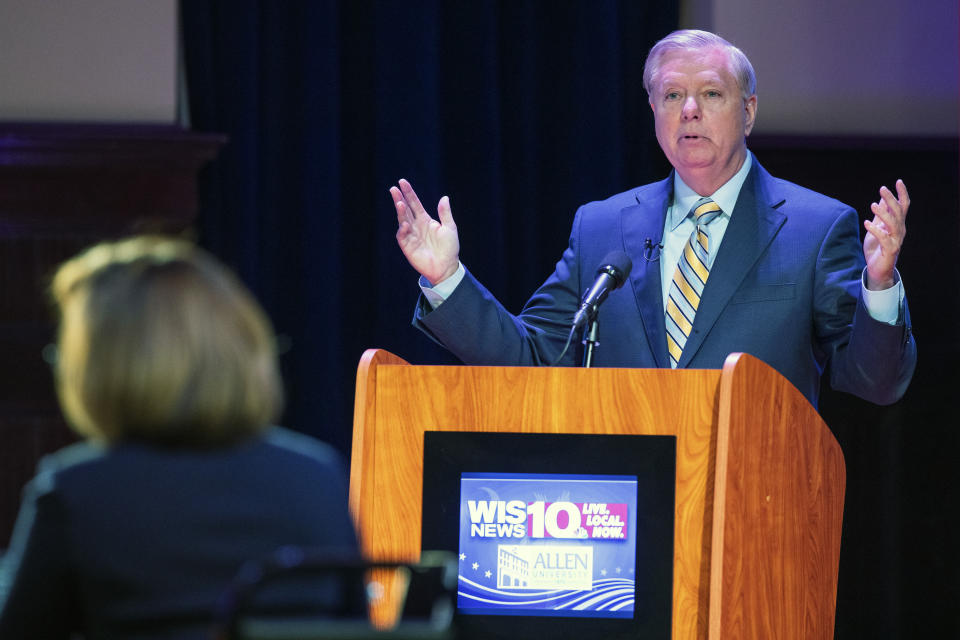 U.S. Sen. Lindsey Graham faces off in the South Carolina U.S. Senate debate with Democratic challenger Jaime Harrison at Allen University in Columbia, S.C., Saturday, Oct. 3, 2020. (Joshua Boucher/The State via AP)