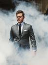 Get back to work in the ultimate businessman fit: gray suit, white dress shirt, black tie. Smoke optional.