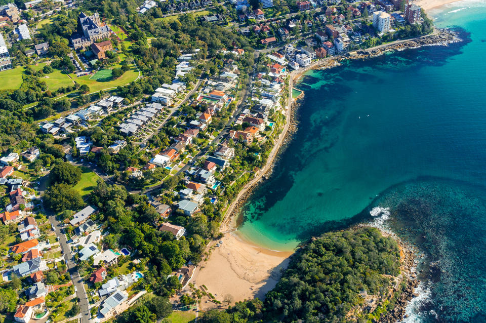 Aerial view on famous Shelly beach and Cabbage Tree bay, Manly. View on Sydney harbourside suburb from above. Aerial view on Sydney neighbourhood, Manly and Cabbage Tree Bay. Image: Getty