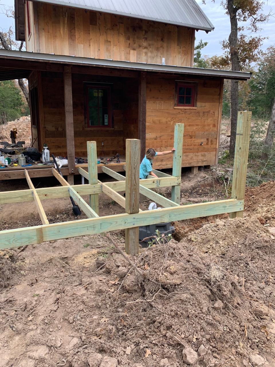 Mckean Matson building her tiny home.