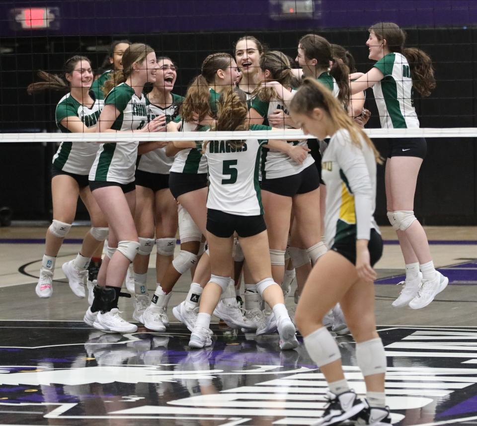 Cornwall players celebrate after defeating Lakeland, 3-1 in the Lakeland vs Cornwall Class A girls volleyball regional final at John Jay High School in Cross River, Nov. 11, 2022.
