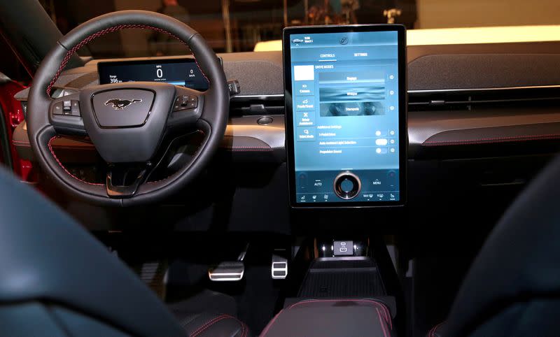 FILE PHOTO: Ford Motor Co's next generation SYNC 4 communications and entertainment system on a 15.5" touchscreen display screen is seen in the interior of Ford's all-new electric Mustang Mach-E vehicle at a studio in Warren, Michigan