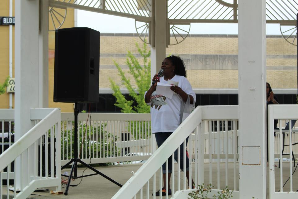 Aretha Grier, the organizer of the Kay Day Peace March, speaks here at the event.