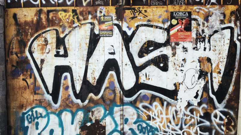 Wall of gritty graffiti.