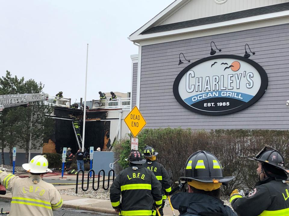 Firefighters work to put out a blaze at Charley's Ocean Bar & Grill in Long Branch on Saturday, April 15, 2023.