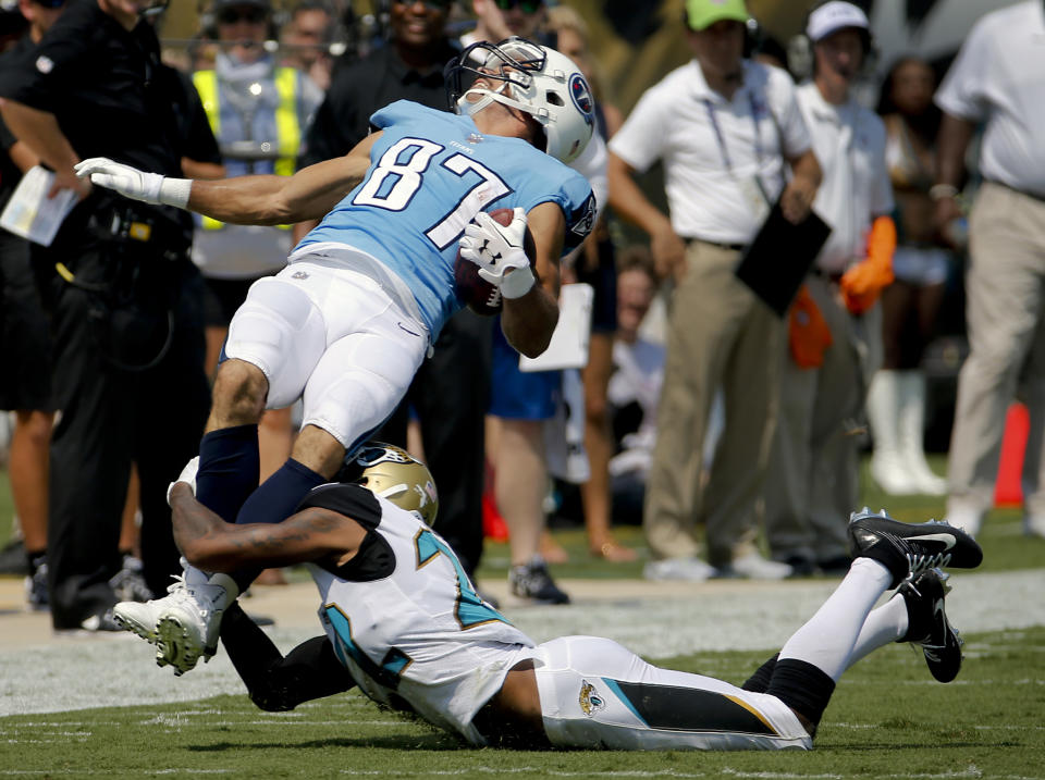 <p>Tennessee Titans wide receiver Eric Decker (87) is tackled by Jacksonville Jaguars cornerback Aaron Colvin after a reception during the first half of an NFL football game, Sunday, Sept. 17, 2017, in Jacksonville, Fla. (AP Photo/Stephen B. Morton) </p>