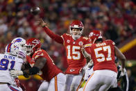 Kansas City Chiefs quarterback Patrick Mahomes (15) throws a pass during overtime in an NFL divisional round playoff football game against the Buffalo Bills, Sunday, Jan. 23, 2022, in Kansas City, Mo. The Chiefs won 42-36. (AP Photo/Charlie Riedel)