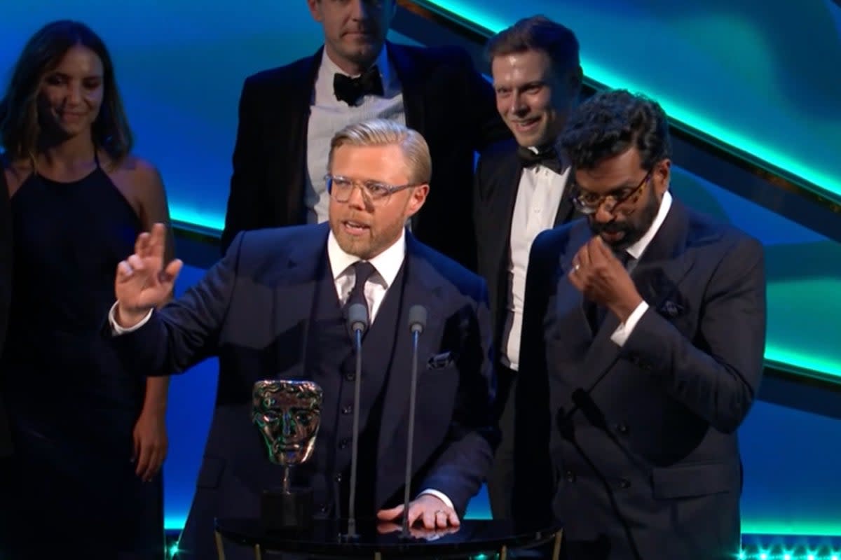 Bafta hosts Rob Beckett and Romesh Ranganathan collect their own Bafta, for Best Comedy Entertainment Programme (BBC)