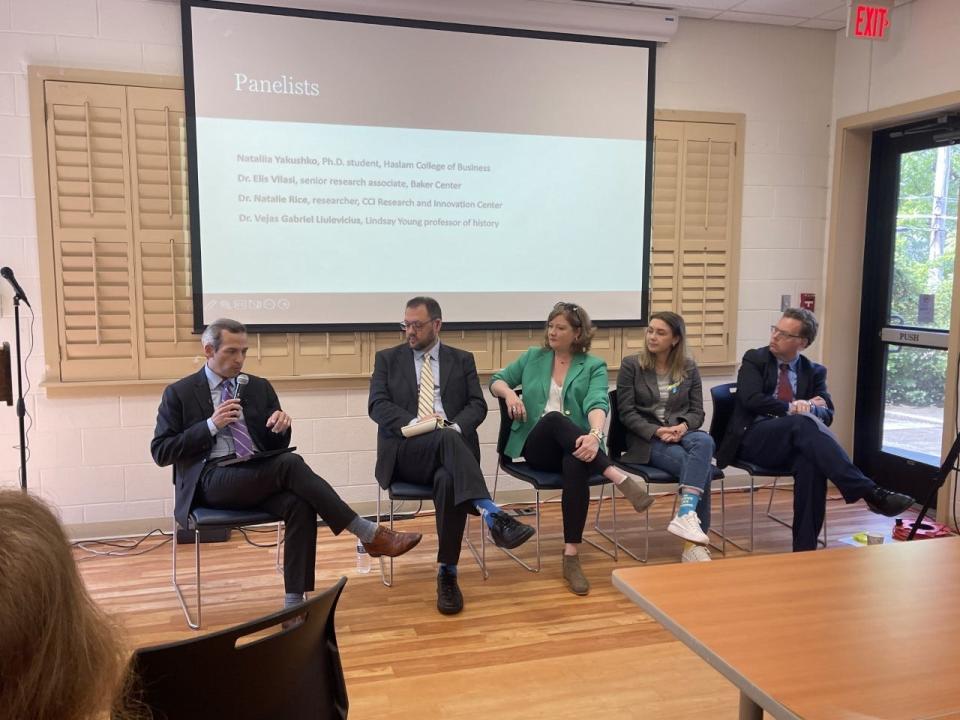 Nick Schifrin, left, makes a point during the reporting symposium. With the correspondent are, from left, panelists Dr. Elis Vllasi, Dr. Natalie Rice, Nataliia Yakushko, and Dr. Vejas G. Liulevicius.