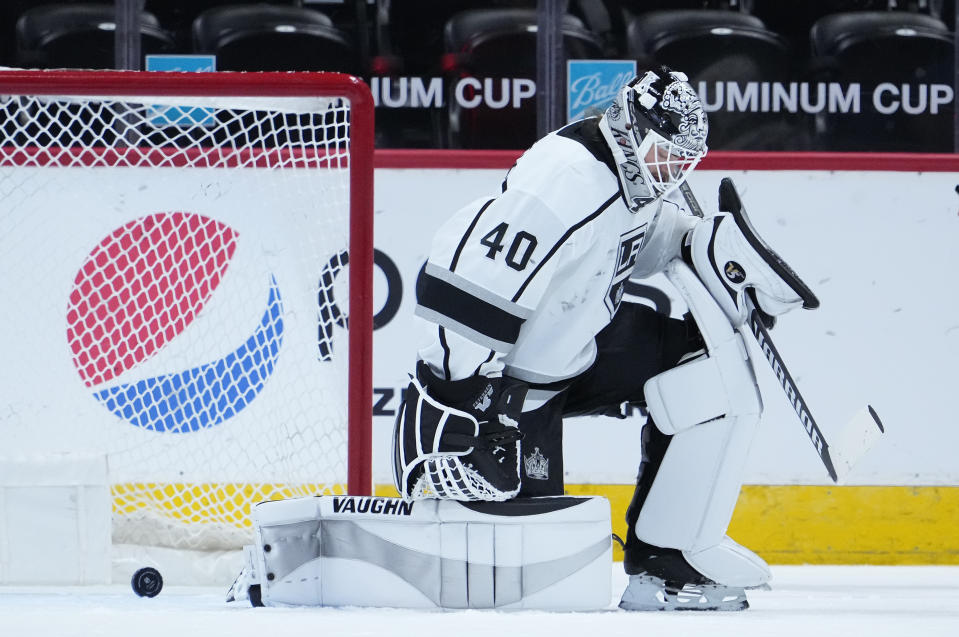 Los Angeles Kings goaltender Calvin Petersen (40) reacts to letting the puck slip past for a goal off the stick of Colorado Avalanche left wing J.T. Compher (37) during the first period of an NHL hockey game Wednesday, May, 12, 2021, in Denver. (AP Photo/Jack Dempsey)