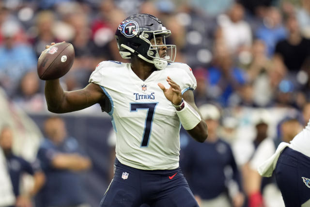 Eddie George of the Tennessee Titans carries the ball during the game