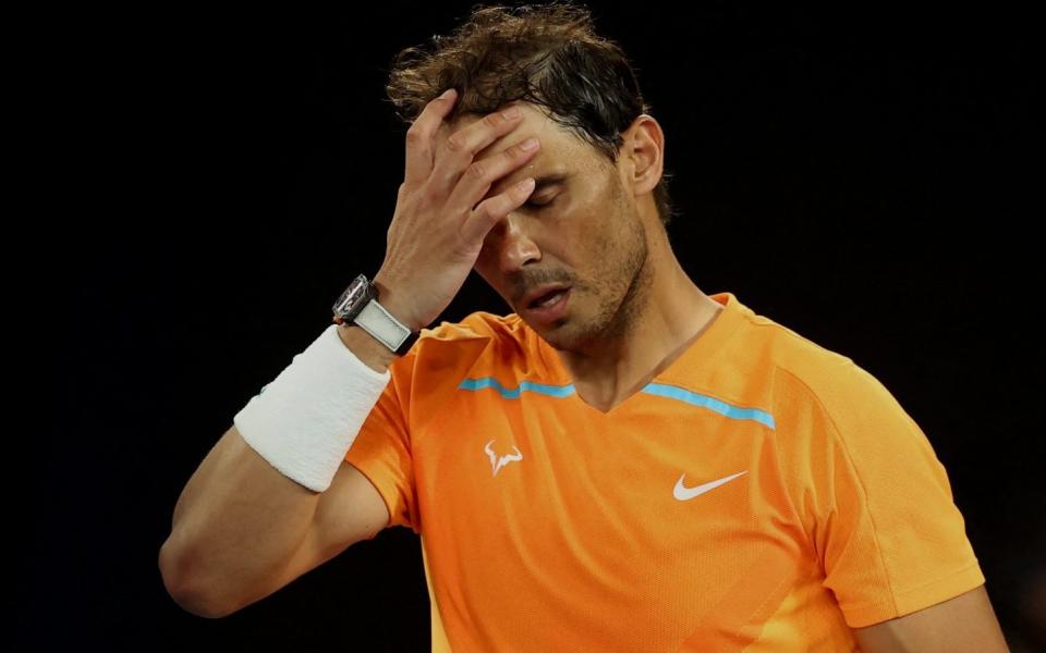 Spain's Rafael Nadal looks dejected after losing his second round match against Mackenzie Mcdonald of the U.S - Rafael Nadal crashes out of Australian Open in straight sets - Carl Recine/Reuters