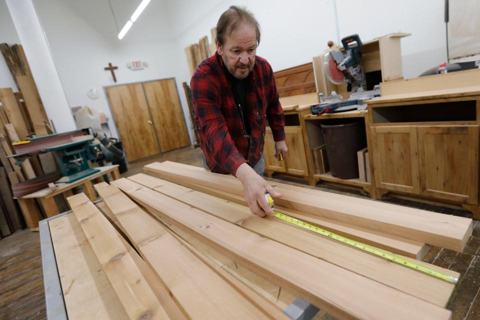 John Giacobbi works on a custom piece in his studio at the Hatch Street Studios in New Bedford.