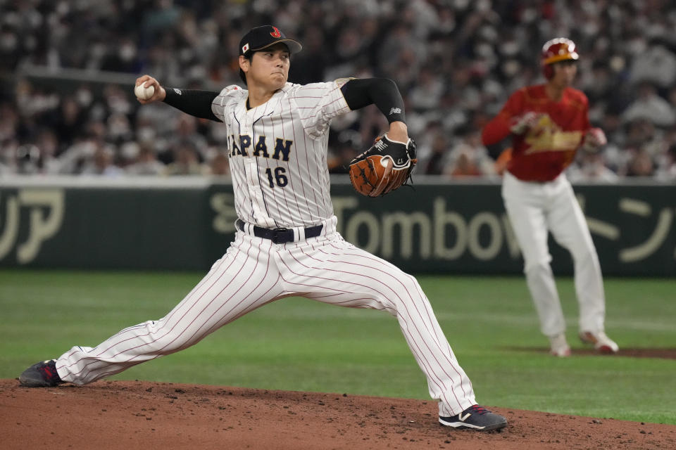 Shohei Ohtani of Japan pitches against China in the fourth inning of the Pool B game, at the World Baseball Classic (WBC) in Tokyo, Japan, Thursday, March 9, 2023.(AP Photo/Eugene Hoshiko)