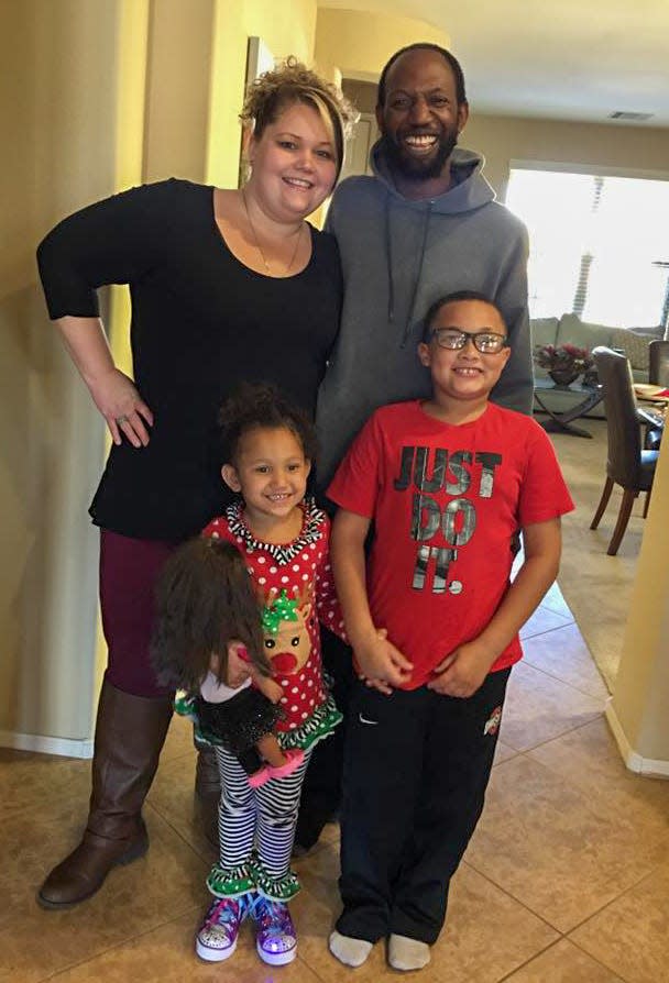 Tim Hawthorne with his wife, Ashley, son Trae, and daughter Alana in their home in 2017.