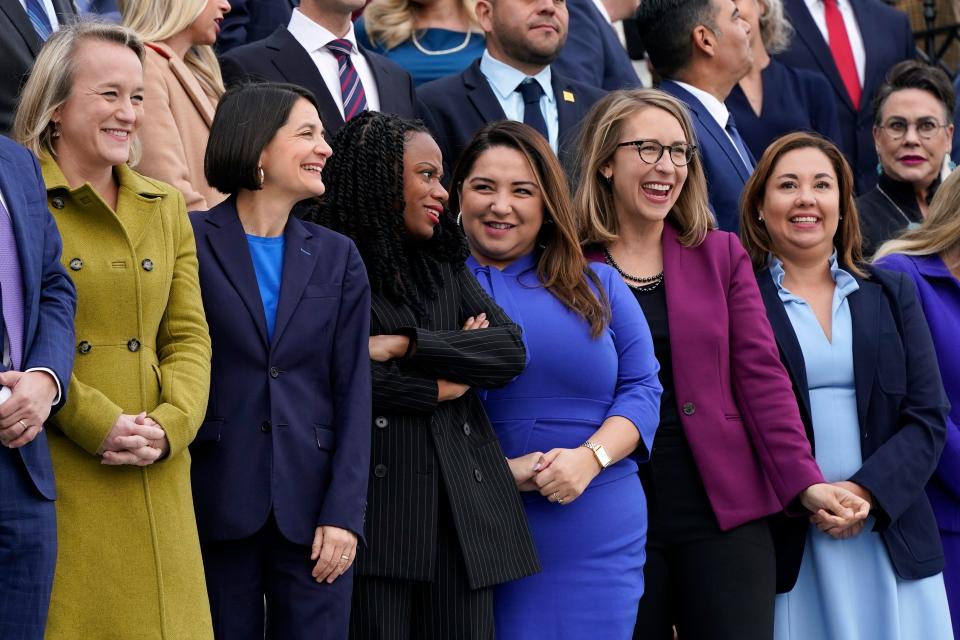 Reps. Nikki Budzinski, D-Ill., from left, Becca Balint, D-Vt., Summer Lee, D-Pa., Delia Ramirez, D-Ill., Hillary Scholten, D-Mich., and Yadira Caraveo, D-Co., stand for a class photo of newly-elected members of Congress in Washington, Tuesday, Nov. 15, 2022.